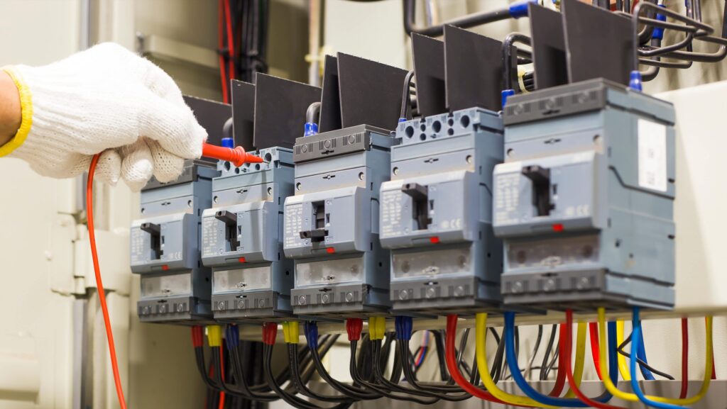 Electrician working on a commercial distribution board